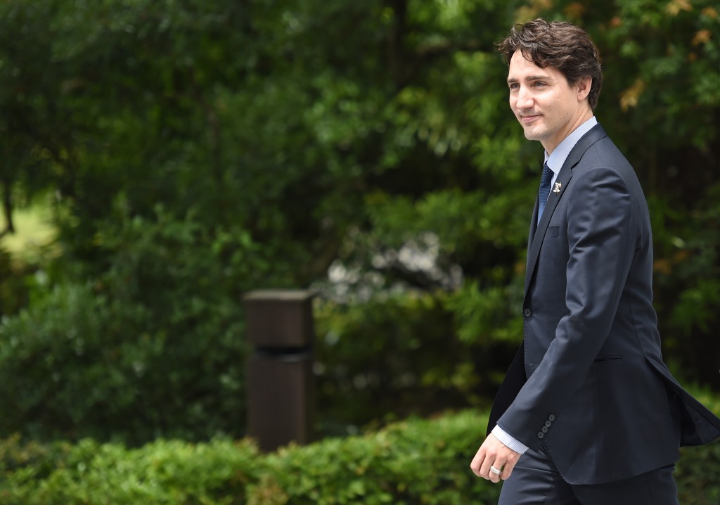 Canadian Prime Minister Justin Trudeau arrives at Ise-Jingu Shrine in the city of Ise in Mie prefecture, on May 26, 2016, on the first day of the G7 leaders summit. World leaders kicked off two days of G7 talks in Japan on May 26 with the creaky global economy, terrorism, refugees, China's controversial maritime claims, and a possible Brexit headlining their packed agenda.  / AFP PHOTO / STEPHANE DE SAKUTIN