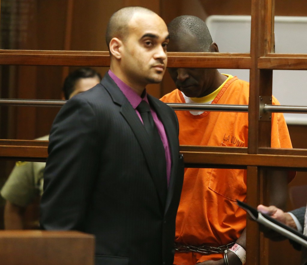 LOS ANGELES, CA - AUGUST 01: Actor Michael Jace (R) and his attorney appear in Los Angeles Superior Court on August 1, 2014 in Los Angeles, California. Jace is charged with the May 19 shooting death of his wife April Jace and has pleaded not guilty and waived his rights to a preliminary hearing.   Frederick M. Brown/Getty Images/AFP