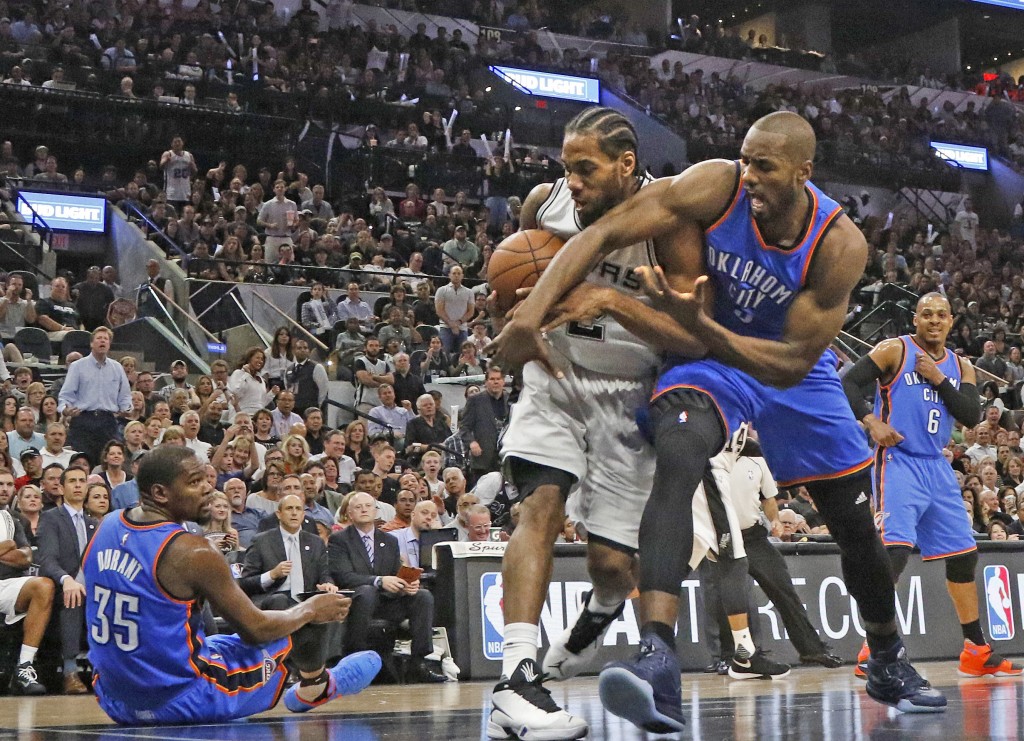 SAN ANTONIO, TX - MAY 10: Kawhi Leonard #2 of the San Antonio Spurs steals the ball away from Serge Ibaka #9 of the Oklahoma City Thunder in game Five of the Western Conference Semifinals during the 2016 NBA Playoffs at AT&T Center on May 10, 2016 in San Antonio, Texas. NOTE TO USER: User expressly acknowledges and agrees that , by downloading and or using this photograph, User is consenting to the terms and conditions of the Getty Images License Agreement.   Ronald Cortes/Getty Images/AFP