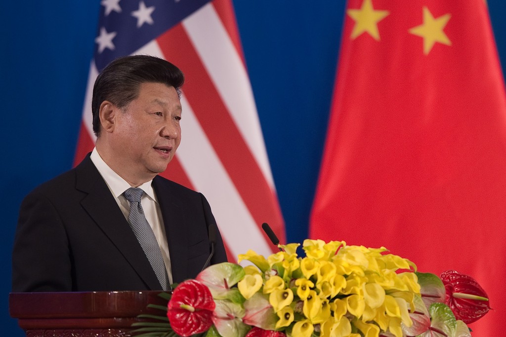 China's President Xi Jinping delivers his speech during the opening session of the US - China Strategic and Economic Dialogues at Diaoyutai State Guesthouse in Beijing on June 6, 2016. / AFP PHOTO / POOL / NICOLAS ASFOURI