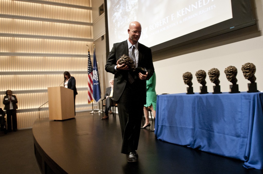 WASHINGTON, DC - MAY 18: David Gilkey accepts the International Photography Award during the 2011 Robert F. Kennedy Center For Justice & Human Rights Book And Journalism Awards at the United States Institute of Peace on May 18, 2011 in Washington, DC.   Kris Connor/Getty Images/AFP