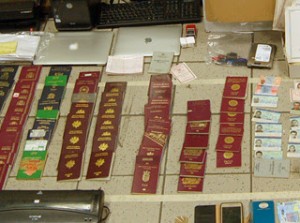 Some of the forged documents, including fake passports, IDs, and other travel documents, that were seized from the suspects arrested with the help of Europol. (Photo from Europol)