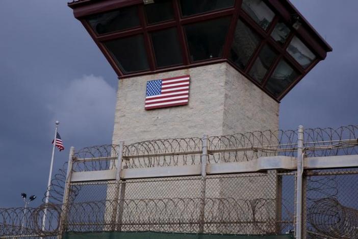 The United States flag decorates the side of a guard tower inside of Joint Task Force Guantanamo Camp VI at the U.S. Naval Base in Guantanamo Bay, Cuba March 22, 2016.  REUTERS/Lucas Jackson/File Photo