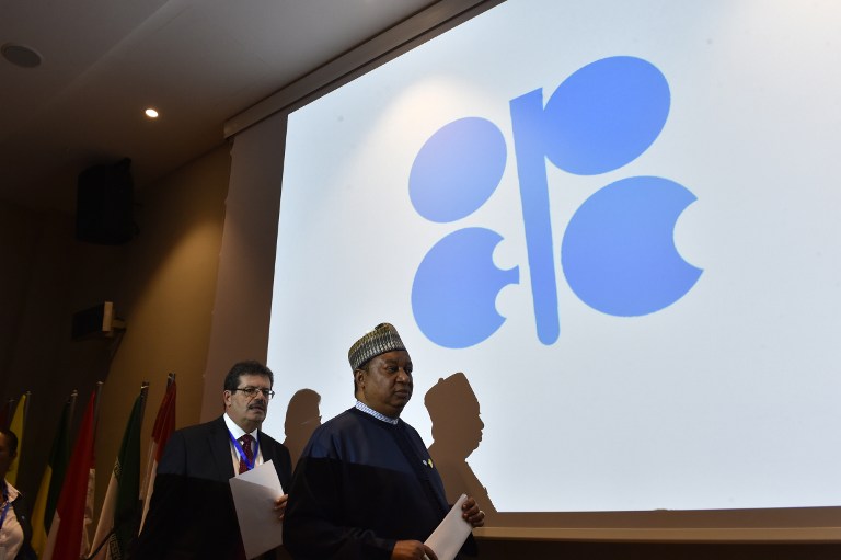 The Secretary General of the Organization of Petroleum Exporting Countries (OPEC) Nigeria's Mohammed Barkindo (R) arrives for a press conference following an informal meeting between OPEC members on September 28, 2016 in the Algerian capital Algiers. / AFP PHOTO / Ryad Kramdi