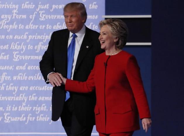 Republican U.S. presidential nominee Donald Trump shakes hands with Democratic U.S. presidential nominee Hillary Clinton at the conclusion of their first presidential debate at Hofstra University in Hempstead, New York, U.S., September 26, 2016. REUTERS/Lucas Jackson