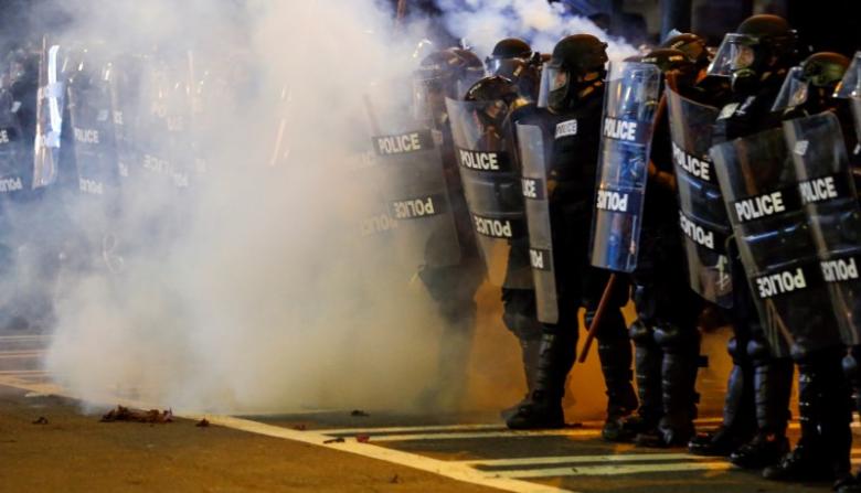 Police hold their lines in uptown Charlotte, NC during a protest of the police shooting of Keith Scott, in Charlotte, North Carolina, U.S. September 21, 2016. REUTERS/Jason Miczek