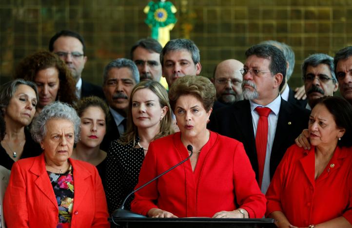 Brazil's former President Dilma Rousseff (C), who was removed by the Brazilian Senate from office earlier, speaks at the Alvorada Palace in Brasilia, Brazil, August 31, 2016. REUTERS/Bruno Kelly