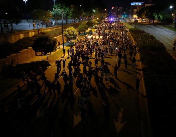 Demonstrators march outside the downtown streets protesting the police shooting of Keith Scott in Charlotte, North Carolina, U.S., September 24, 2016.    REUTERS/Mike Blake