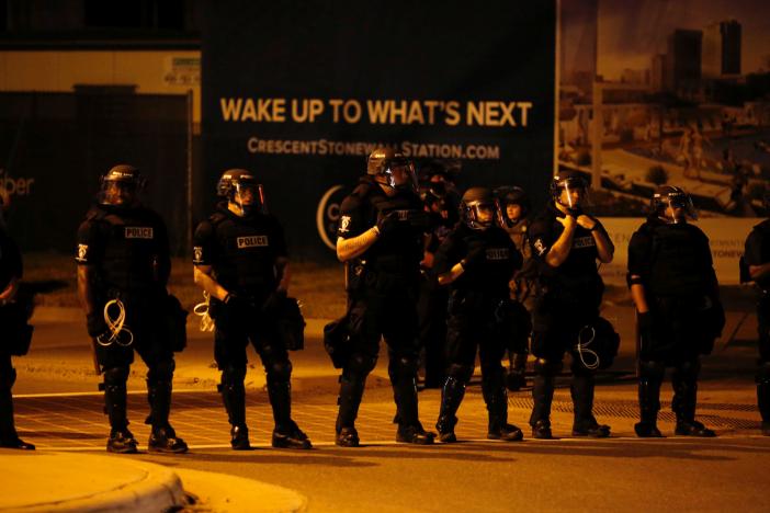 Police monitor marchers protesting the police shooting of Keith Scott in Charlotte, North Carolina, U.S. September 24, 2016.    REUTERS/Jason Miczek