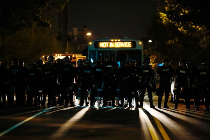 Riot police assemble to enforce a curfew as marchers protest the police shooting of Keith Scott in Charlotte, North Carolina, U.S., September 24, 2016.  REUTERS/Jason Miczek