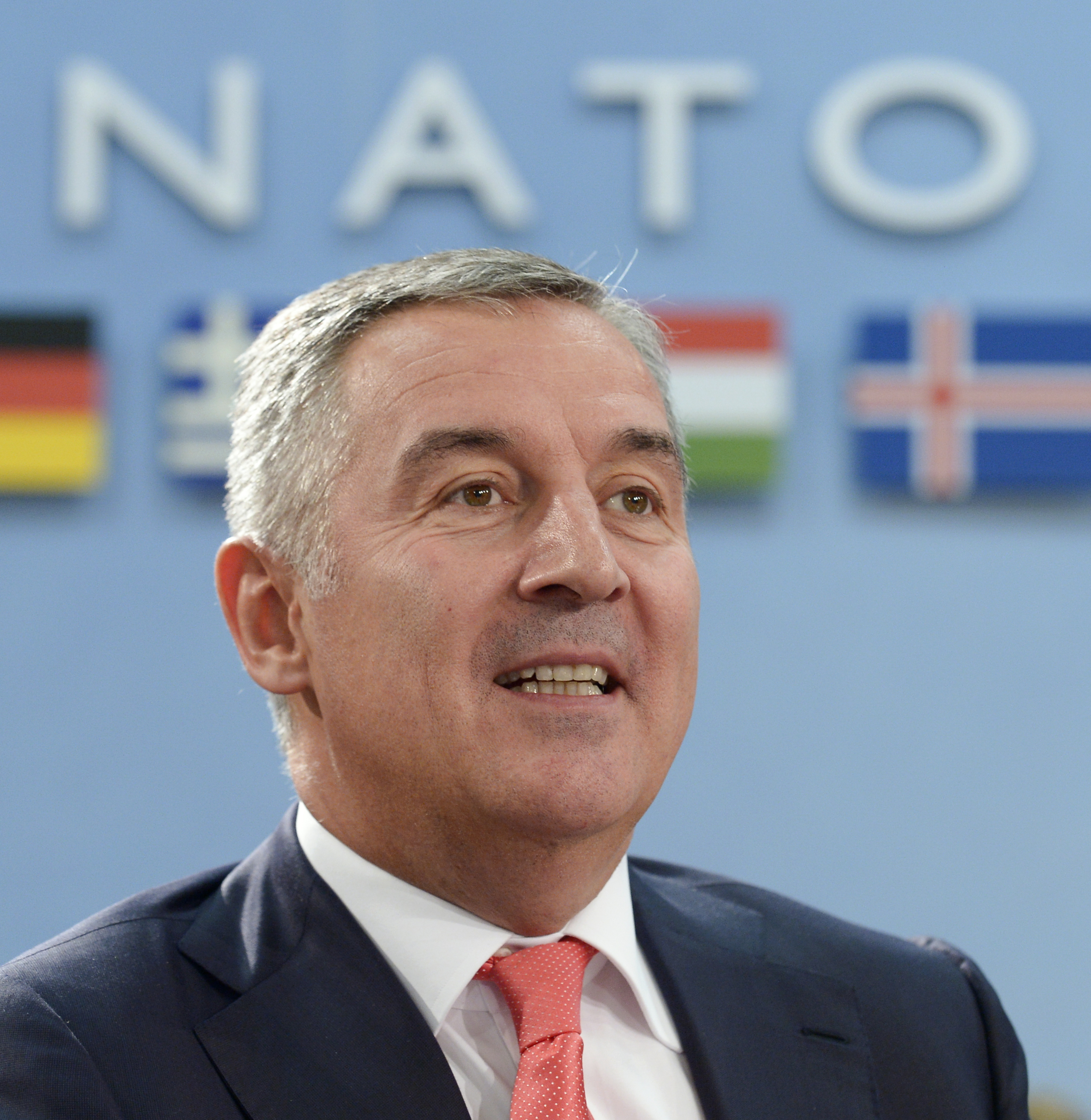 Montenegro's Prime Minister Milo Djukanovic looks on during a foreign affairs ministers meeting at the NATO headquarters in Brussels on May 19, 2016. NATO foreign ministers met to finalise the alliance's biggest military build-up since the end of the Cold War to counter what they see as a more aggressive and unpredictable Russia. At a Warsaw summit in July, NATO leaders will sign-off on the revamp which puts more troops into east European member states as part of a "deter and dialogue" strategy, meant to reassure allies they will not be left in the lurch in any repeat of the Ukraine crisis. / AFP PHOTO / JOHN THYS