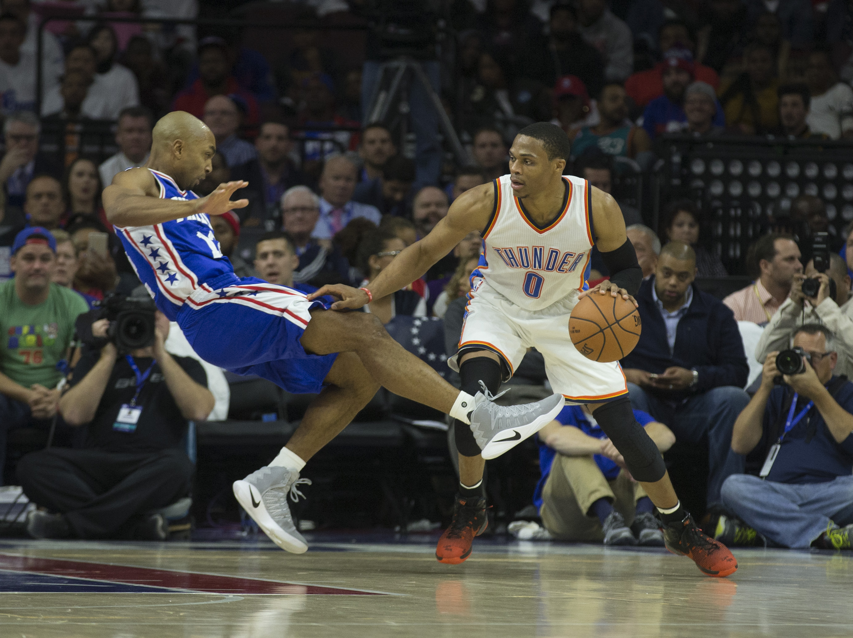 PHILADELPHIA, PA - OCTOBER 26: Russell Westbrook #0 of the Oklahoma City Thunder drives into Gerald Henderson #12 of the Philadelphia 76ers in the second quarter at Wells Fargo Center on October 26, 2016 in Philadelphia, Pennsylvania. NOTE TO USER: User expressly acknowledges and agrees that, by downloading and or using this photograph, User is consenting to the terms and conditions of the Getty Images License Agreement.   Mitchell Leff/Getty Images/AFP