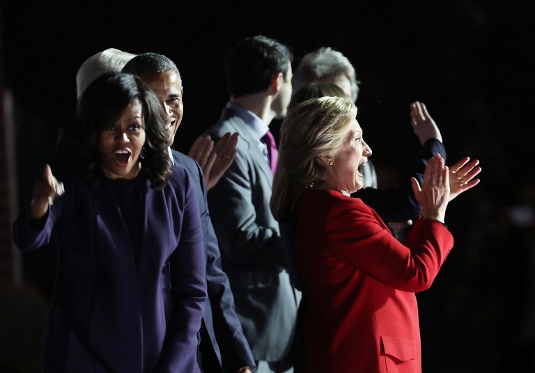 PHILADELPHIA, PA - NOVEMBER 07: Democratic presidential nominee former Secretary of State Hillary Clinton stands with President Barack Obama and Michelle Obama during an election eve rally on November 7, 2016 in Philadelphia, Pennsylvania. As the historic race for the presidency of the United States comes to a conclusion, both Clinton and her rival Donald Trump are making their last appearances before voting begins tomorrow. Spencer Platt/Getty Images/AFP