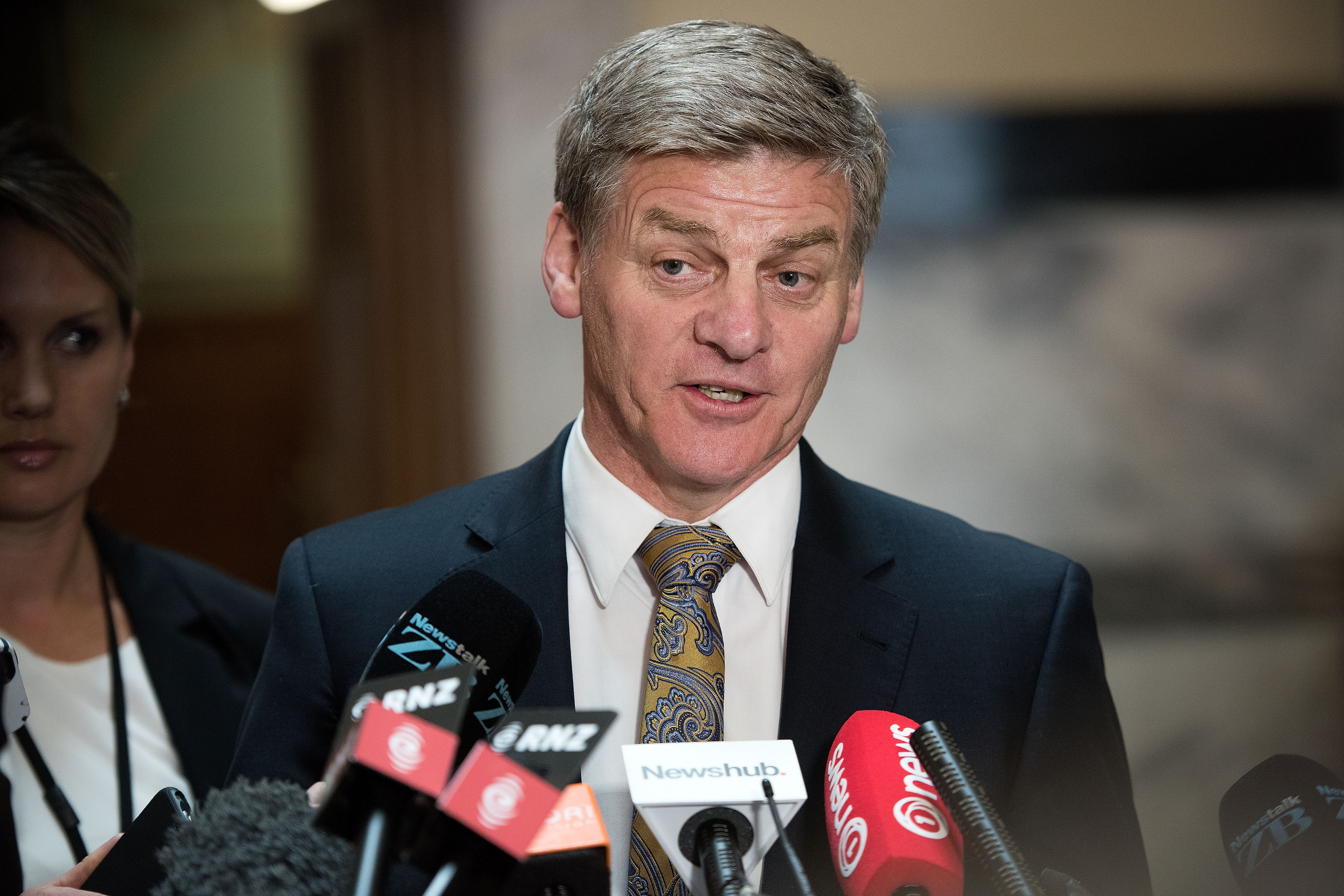 New Zealand Deputy Prime Minister Bill English speaks to the media during a press conference at Parliament in Wellington on December 5, 2016.  Prime Minister of New Zealand John Key announced his resignation that will take effect from December 12. English has been put forward by Key as his replacement. / AFP PHOTO / Marty Melville