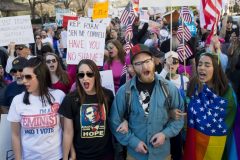 Demonstrators march from Dupont Circle to the White House during a "Not My President Day" protest against US President Donald Trump on President's Day in Washington, DC, February 20, 2017. / AFP PHOTO / SAUL LOEB