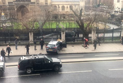 A picture obtained from the Twitter account of James West, shows a car stopped on the sidewalk in front of the Palace of Westminster which houses the Houses of Parliament in central London  on March 22, 2017 during an incident. British police shot a suspected attacker outside the Houses of Parliament in London after an officer was stabbed in what police said was a "terrorist" incident. The building in the heart of the British capital was immediately sealed off and MPs and staff ordered to remain inside. TV pictures showed traffic halted on the nearby Westminster Bridge and emergency vehicles swarming around. The busy bridge was completely shut off to traffic. / AFP PHOTO / Handout / James WEST / RESTRICTED TO EDITORIAL USE - MANDATORY CREDIT "AFP PHOTO /  James West" - NO MARKETING NO ADVERTISING CAMPAIGNS - DISTRIBUTED AS A SERVICE TO CLIENTS