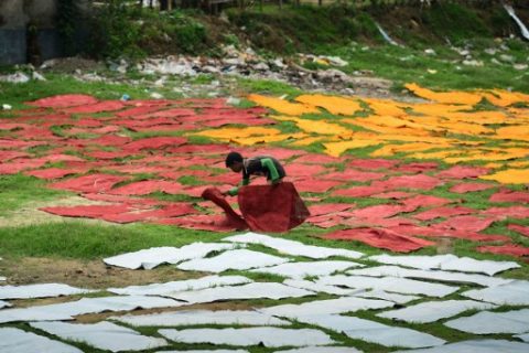 A Bangladeshi worker dries pieces of processed leather at a tannery in Dhaka on April 6, 2017. A historic leatherworking quarter in Bangladesh once labelled among the most polluted places on earth was shut by court order on April 6 in a landmark ruling to protect a vital waterway. Conservationists have been fighting for years to close the century-old tannery district in the capital Dhaka, which pumps thousands of litres of toxic waste directly into the city's most important river on a daily basis. / AFP PHOTO / -