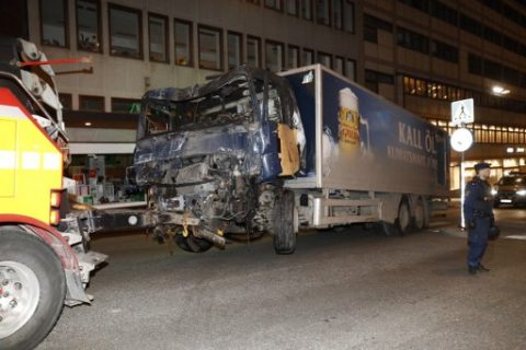 The stolen truck, which was driven through a crowd outside a department in Stockholm on April 7, 2017, is taken away on April 8. A massive manhunt was underway for the driver of the stolen truck that ploughed into the crowd, killing four and injuring 15, Swedish police said. National police chief, Stefan Hector, said the police's "working hypothesis is that this is a terror attack." / AFP PHOTO / Odd ANDERSEN