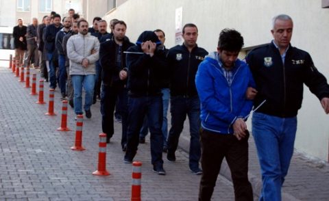 This image obtained from Dogan News Agency (DHA) shows Turkish police officers escorting people after their arrest for alleged links with US-based Muslim cleric Fethullah Gulen on April 26, 2017 in the central city of Kayseri. Turkey detained over 1,000 alleged supporters of US-based Muslim cleric Fethullah Gulen, the biggest crackdown since President Recep Tayyip Erdogan's victory in a referendum on ramping up his powers. A total of 1,009 suspects have so far been detained in raids in 72 provinces across the country, the official Anadolu news agency quoted Interior Minister Suleyman Soylu as saying.  / AFP PHOTO / DOGAN NEWS AGENCY / Olcay DUZGUN / Turkey OUT