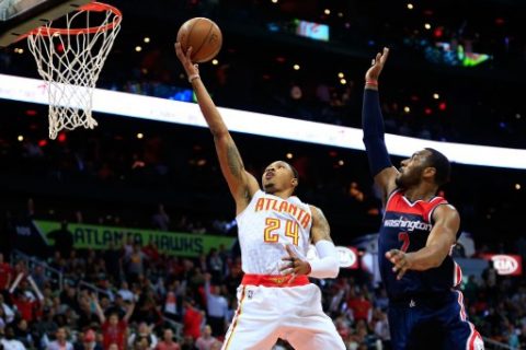 ATLANTA, GA - APRIL 24: Kent Bazemore #24 of the Atlanta Hawks goes up for a basket against John Wall #2 of the Washington Wizards during the second quarter in Game Four of the Eastern Conference Quarterfinals during the 2017 NBA Playoffs at Philips Arena on April 24, 2017 in Atlanta, Georgia. NOTE TO USER: User expressly acknowledges and agrees that, by downloading and or using the photograph, User is consenting to the terms and conditions of the Getty Images License Agreement. Daniel Shirey/Getty Images/AFP