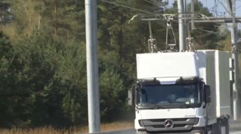 German engineering group Siemens presents its "eHighway," a test track outside Berlin where trucks powered by electric overhead wires are developed to "protect the environment."(photo grabbed from Reuters video)