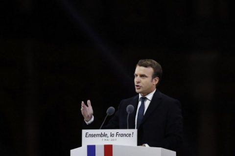 Supporters of French president-elect Emmanuel Macron delivers a speech at the Louvre Museum in Paris on May 7, 2017, after the second round of the French presidential election. Emmanuel Macron was elected French president on May 7, 2017 in a resounding victory over far-right Front National (FN - National Front) rival after a deeply divisive campaign. / AFP PHOTO / Patrick KOVARIK