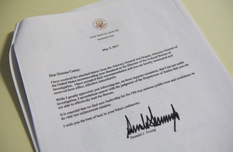 A copy of the termination letter to FBI Director James Comey from US President Donald Trump is seen at the White House on May 9, 2017 in Washington, DC. / AFP PHOTO / MANDEL NGAN