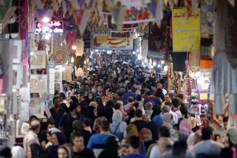 Iranians shop in the Grand Bazaar in southern Tehran's Molavi neighbourhood on May 11, 2017. In a working class district of southern Tehran teeming with porters, motorbikes and pickup trucks, residents have little enthusiasm about next week's presidential election. Iranians have tried it all -- reformists, establishment figures, rabble-rousing populists, and for the past four years a moderate cleric, President Hassan Rouhani, who made great efforts to reintegrate the country with the world. / AFP PHOTO / ATTA KENARE