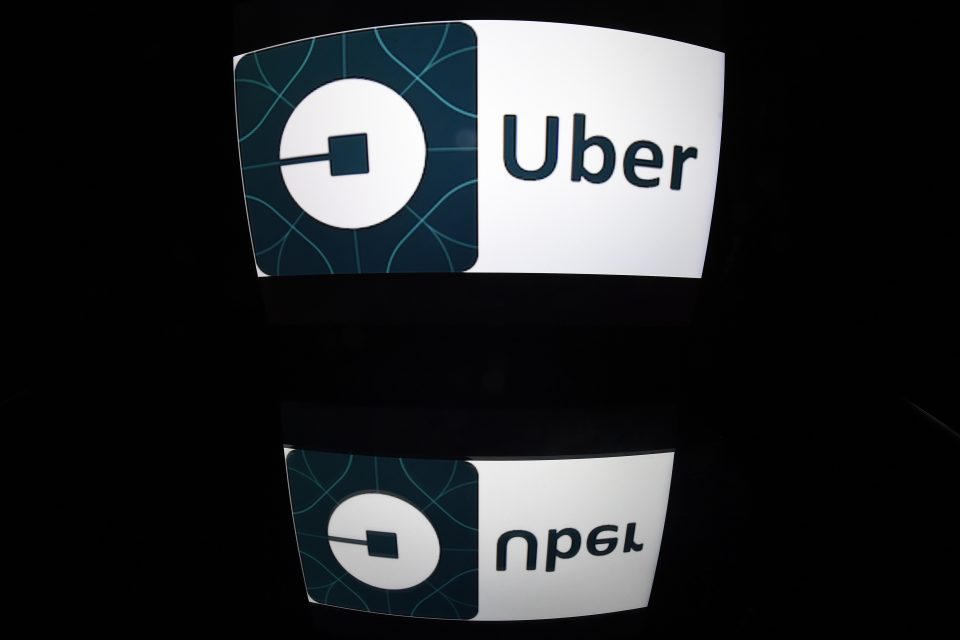 (FILES) This file photo taken on December 28, 2016 shows the logo of Uber in Paris.  Ride-hailing app Uber may be a pioneer in its field but at heart it is an ordinary taxi company and should be regulated as such, a top EU lawyer said on May 11, 2017. / AFP PHOTO / Lionel BONAVENTURE