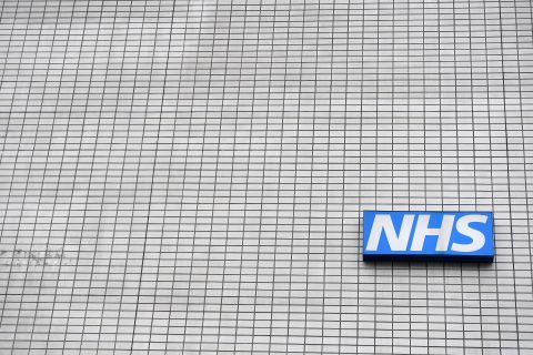 (FILES) This file photo taken on March 08, 2017 shows a NHS (National Health Service) sign pictured outside St Thomas' Hospital in central London. Several British hospitals were hit by a cyber attack on May 12, 2017, the country's National Health Service said, forcing some to cancel routine appointments. "A number of NHS organisations have reported to NHS Digital that they have been affected by a ransomware attack," the public health service said in a statement. / AFP PHOTO / BEN STANSALL