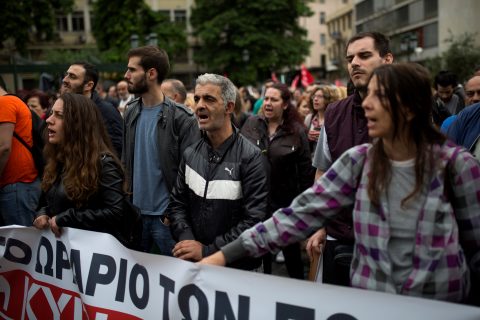 Members of the "All Workers militant front" (PAME), a Trade Union coalition, take part in a demonstration marking a 24-hour general strike against a new round of austerity cuts imposed by the country's international creditors in Athens, on May 17, 2017. / AFP PHOTO / Angelos Tzortzinis