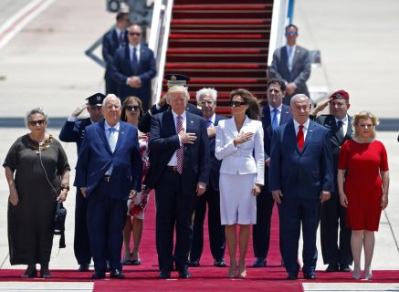 US President Donald Trump (C-L) and First Lady Melania Trump (C-R) listen to the their national anthem as they are welcomed by Israeli Prime Minister Benjamin Netanyahu (2R), his wife Sara (R), Israeli President Reuven Rivlin (2L), and his wife Nehama (L), during a welcome ceremony upon their arrival at Ben Gurion International Airport in Tel Aviv on May 22, 2017, as part of his first trip overseas. / AFP PHOTO / Jack GUEZ