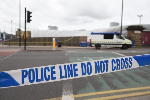 A police cordon surrounds Manchester Arena in Manchester, northwest England following the deadly terror attacks on May 23, 2017. Twenty two people have been killed and dozens injured in Britain's deadliest terror attack in over a decade after a suspected suicide bomber targeted fans leaving a concert of US singer Ariana Grande in Manchester. / AFP PHOTO / Oli SCARFF