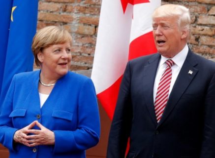 German Chancellor Angela Merkel and US President Donald Trump pose for a family picture as they attend the Summit of the Heads of State and of Government of the G7, the group of most industrialized economies, plus the European Union, on May 26, 2017 at the ancient Greek Theater in Taormina, Sicily. The leaders of Britain, Canada, France, Germany, Japan, the US and Italy will be joined by representatives of the European Union and the International Monetary Fund (IMF) as well as teams from Ethiopia, Kenya, Niger, Nigeria and Tunisia during the summit from May 26 to 27, 2017. / AFP PHOTO / POOL / PHILIPPE WOJAZER / ALTERNATIVE CROP