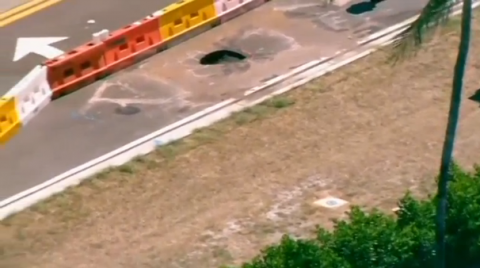 A sinkhole appeared on a road directly in front of U.S. President Donald Trump's Mar-a-Lago resort in Palm Beach, Florida. Repair crews, on Monday (May 22) put up barricades around the small hole that measured about four feet by four feet (1.2 x 1.2 meters), local media reported. City workers believe the sinkhole formed near a newly-installed water main and will conduct an exploratory excavation later in the day.(photo grabbed from Reuters video)