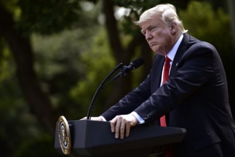 US President Donald Trump announces his decision to withdraw the US from the Paris Climate Accords in the Rose Garden of the White House in Washington, DC, on June 1, 2017. Trump complained that the deal, which was signed under his predecessor President Barack Obama, gives other countries an unfair advantage over US industry and destroys American jobs. / AFP PHOTO / Brendan Smialowski