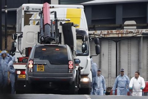 A white van used in the attack on London Bridge is seen being loaded into another van by the police as forensics officers work on London Bridge in London on June 4, 2017, as part of their investigations following the terror attack on the bridge and at the nearby Borough Market on June 3. Seven people were killed in a terror attack on Saturday by three assailants on London Bridge and in the bustling Borough Market nightlife district, the chief of London's police force said on Sunday. / AFP PHOTO / Odd ANDERSEN