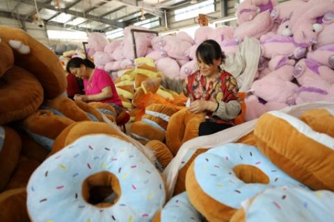 Two women make toys for export at a factory in Ganyu, in China's eastern Jiangsu province on June 9, 2017. Prices for goods at the factory gate in China missed expectations in May, the government said on June 9, 2017, in a possible sign of weakening demand for the world's second-largest economy. / AFP PHOTO / STR / China OUT