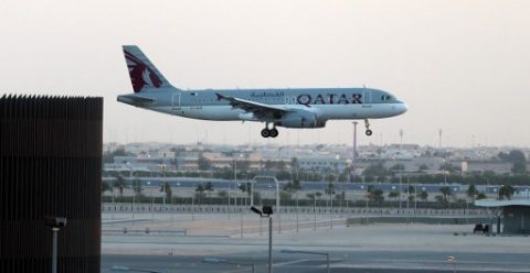 A Qatar Airways plane lands at the Hamad International Airport in the Qatari capital Doha on June 12, 2017. Qatar Airways called on the UN's aviation body to declare a Gulf boycott against the carrier "illegal" and a violation of a 1944 convention on international air transport. Saudi Arabia, the UAE, Bahrain and Egypt this month announced they had suspended ties with Qatar over the emirate's alleged support for extremists, banning all flights to and from the capital Doha and shutting down the offices of the country's national carrier. / AFP PHOTO / KARIM JAAFAR