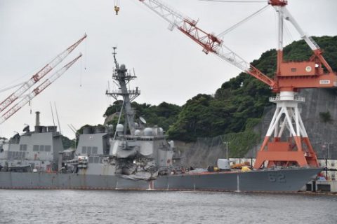 This photo shows damages on the guided missile destroyer USS Fitzgerald at its mother port in Yokosuka, southwest of Tokyo on June 18, 2017. A number of missing American sailors have been found dead in flooded areas of a destroyer that collided with a container ship off Japan's coast, the US Navy said on June 18, 2017. / AFP PHOTO / Kazuhiro NOGI