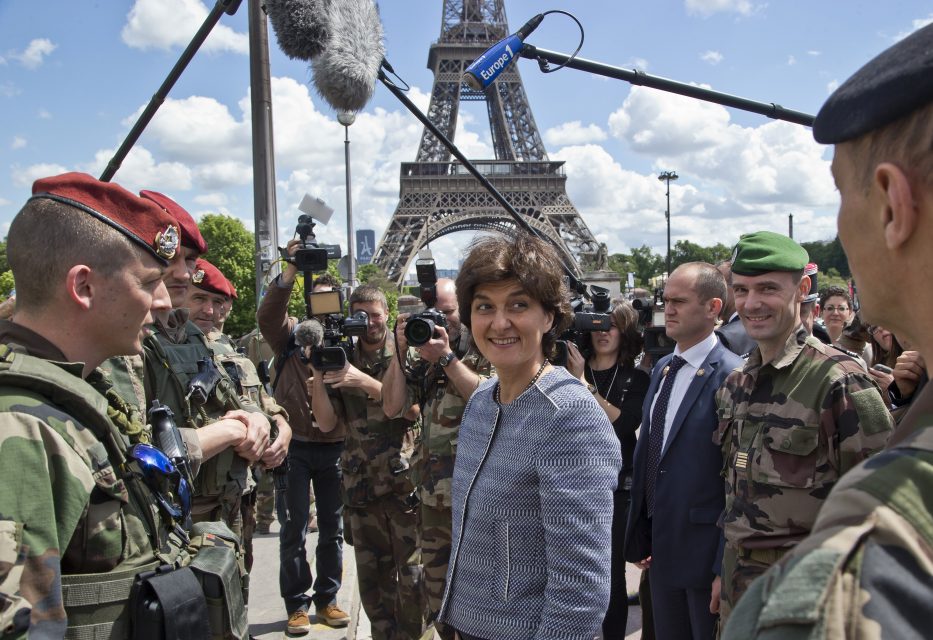 (FILES) This file photo taken on May 20, 2017 at the Eiffel tower in Paris shows France's Defence Minister Sylvie Goulard (C) meeting French soldiers of the "Operation Sentinelle".  French Defence Minister Sylvie Goulard announced her resignation on June 20, 2017 over a fake jobs scandal that has hit her small centrist MoDem party, allied with President Emmanuel Macron's party. Goulard, who was previously a member of the European Parliament, said she could not remain in the government while there was a possibility that she could be investigated over alleged misuse of expenses at the parliament.  / AFP PHOTO / POOL / Michel Euler