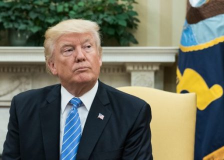 US President Donald Trump looks on as he meets with his Ukrainian counterpart Petro Poroshenko in the Oval Office at the White House in Washington, DC, on June 20, 2017. / AFP PHOTO / NICHOLAS KAMM