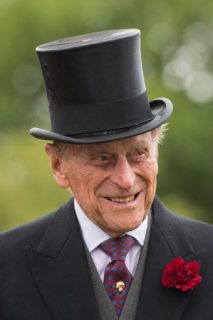 (FILES) This file photo taken on May 23, 2017 shows Britain's Prince Philip, Duke of Edinburgh greets guests, after observing a minute's silence at the start of a Special Garden Party at Buckingham Palace in London on May 23, 2017. Prince Philip, the 96-year-old husband of Queen Elizabeth II, has been admitted to hospital as a "precautionary measure" for treatment of an infection, Buckingham Palace said on June 21, 2017. The infection arose from "a pre-existing condition", the palace said. The Duke of Edinburgh, who is to retire from public duties later this year, was admitted to hospital on June 20 night. / AFP PHOTO / POOL / Dominic Lipinski