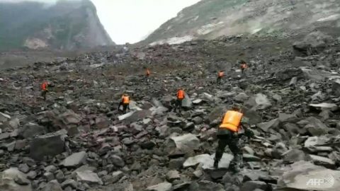 some-40-homes-in-the-village-of-xinmo-were-swallowed-by-huge-boulders-after-the-side-of-a-mountain-collapsed-blocking-a-two-kilometre-one-mile-stretch-of-river-1498275836009-2. AFP/CCTV